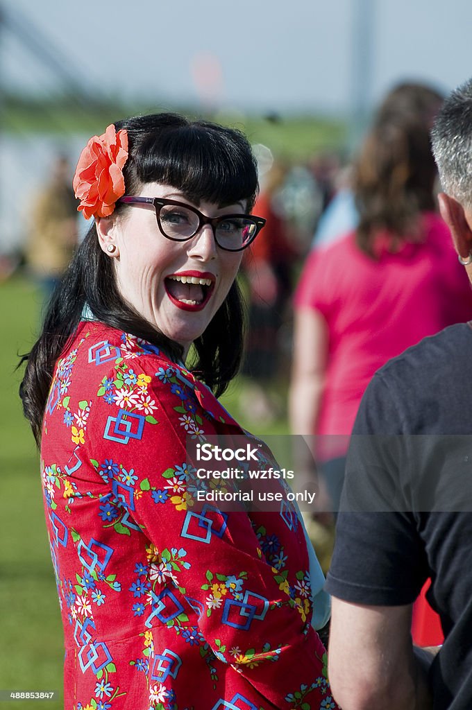 Surprised 1950's woman Northampton,UK-may 03 2014: A woman dressed in retro vintage 1950's style, grins as she looks at camera 1950-1959 Stock Photo