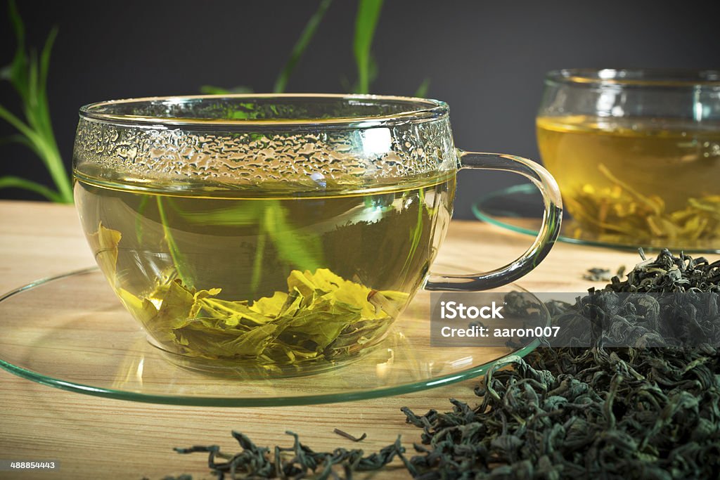 Green Tea still life with green tea and loose tea Bamboo - Plant Stock Photo