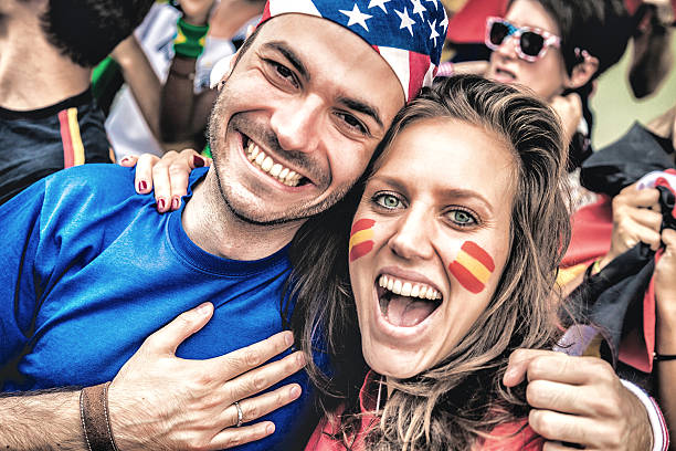 istock USA and Spain fans together 488855383
