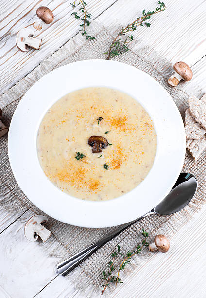 istock Champignons mushroom soup on a wooden board 488856529