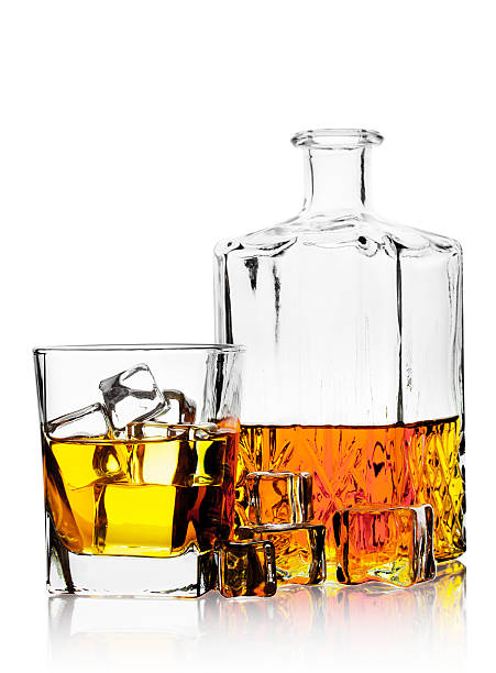 istock Glass of whiskey with ice and decanter 488869989