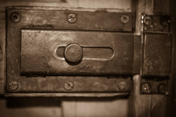 Old lock latch. Vintage background. Sepia photo.