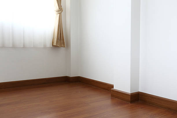 istock white mortar wall and wood floor in the room 488871126