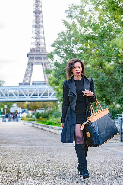 istock Stylish Young African Woman Walking By The Eiffel Tower 488871854