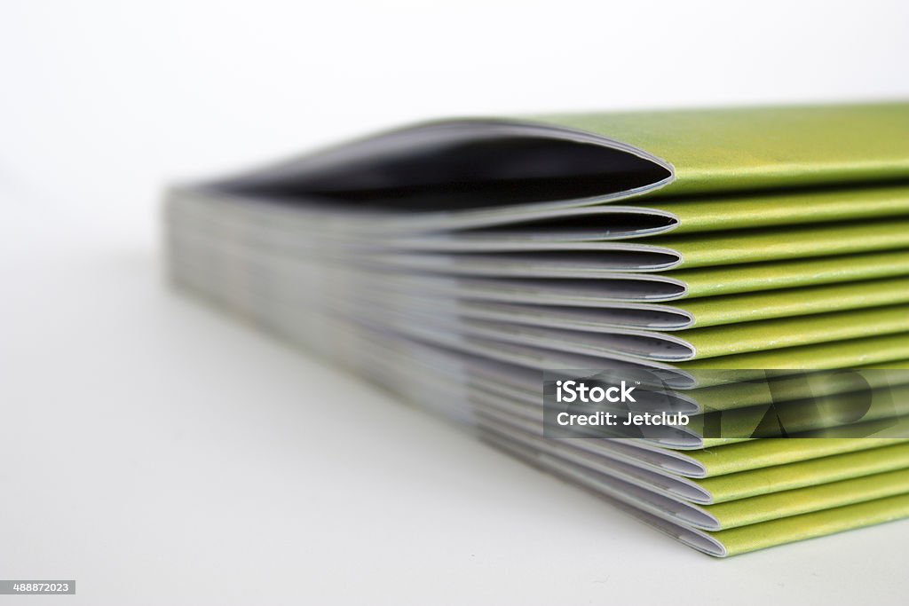 Green Magazines A stack of green magazines Brochure Stock Photo