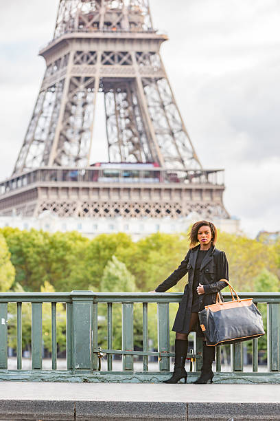 istock Stylish Young African Woman Walking By The Eiffel Tower 488872104