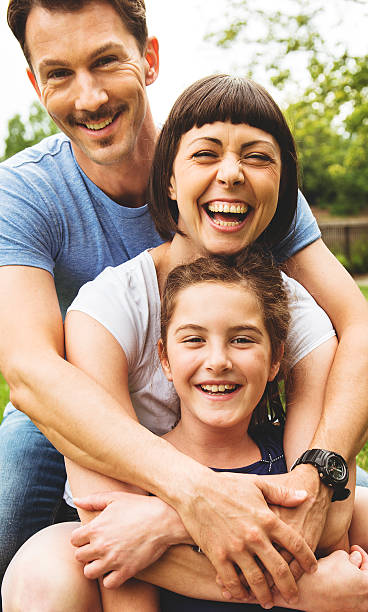 istock Happy family walking outdoors in the park 488872677