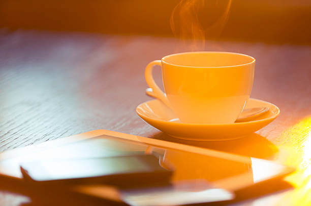 Digital tablet, mobile phone and credit card on a coffee table