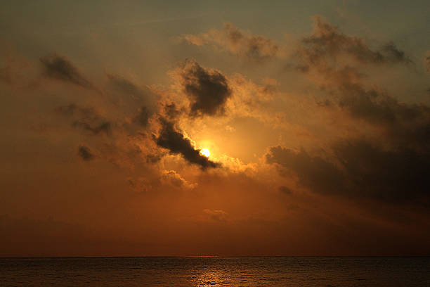 istock sunset in the sea 488873590