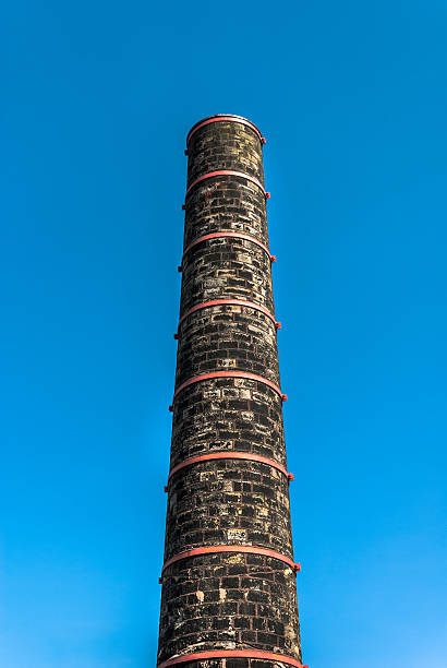Old Mill chimney with metals bands along the Rochdale canal near Hebden Bridge, West Yorkshire.