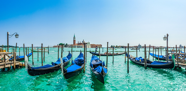 Beautiful view of traditional Gondolas on Canal Grande with San Giorgio Maggiore church in the background, San Marco, Venice, Italy