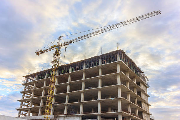 istock Construction site with crane and building at sky sunset. 488874950