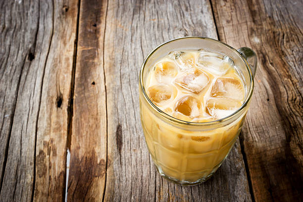 istock Ice coffee on wooden background. 488875210