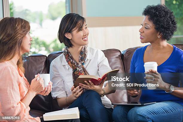 Group Of Friends Having Coffee During Bible Study Discussion Stock Photo - Download Image Now