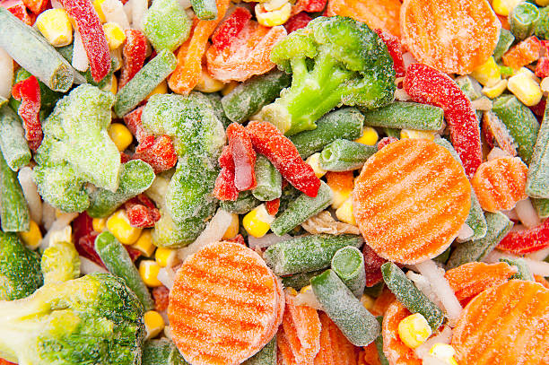 Frozen vegetables Close up of frozen vegetables frozen water stock pictures, royalty-free photos & images