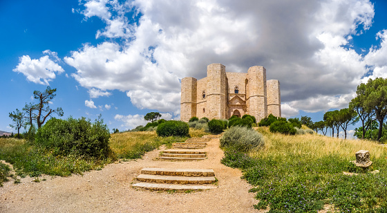 Apulia, Italy - June 30, 2014: Beautiful view of Castel del Monte, the famous castle built in an octagonal shape by the Holy Roman Emperor Frederick II in the 13th century in Apulia, southeast Italy