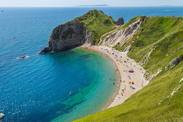 Lulworth Cove in Cornwall, England View from Lulworth Cove to Durdle Door in Cornwall, England  jurassic coast world heritage site stock pictures, royalty-free photos & images