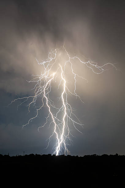 istock lightning and clouds in night landscape storm 488877240
