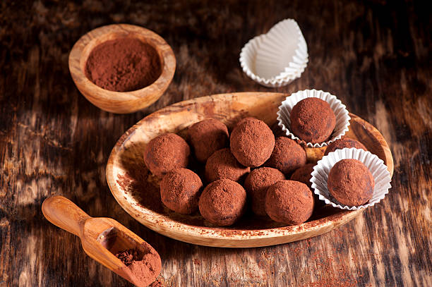 istock Chocolate truffles and cocoa powder 488880102