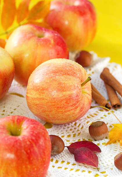 Fresh apples with nuts and seasoning in autumn