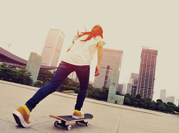 istock speeding skateboarding woman 488887763