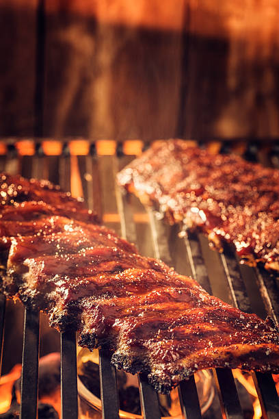 istock Marinated BBQ Pork Ribs on Barbecue Grill 488887879