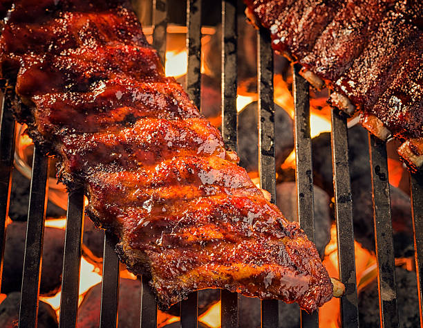 istock Marinated BBQ Pork Ribs on Barbecue Grill 488887881