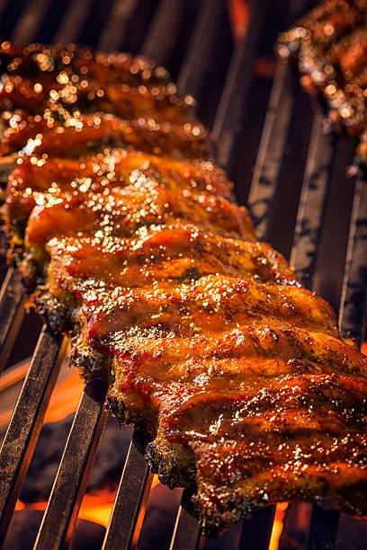istock Marinated BBQ Pork Ribs on Barbecue Grill 488887889