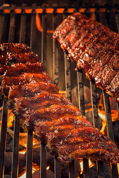 istock Marinated BBQ Pork Ribs on Barbecue Grill 488887895
