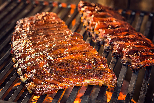 istock Marinated BBQ Pork Ribs on Barbecue Grill 488887901