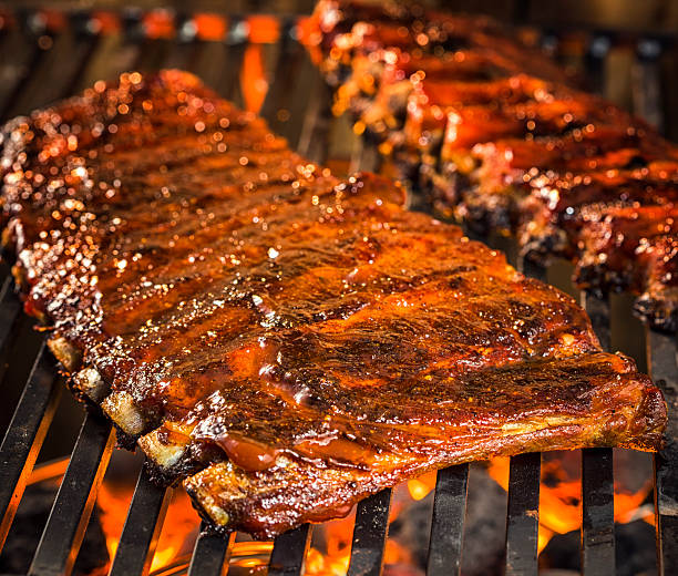 istock Marinated BBQ Pork Ribs on Barbecue Grill 488887903