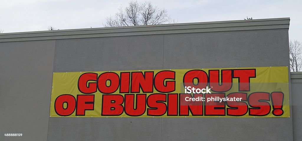 Going Out of Business A going out of business banner on a bankrupt storefront Going Out Of Business Stock Photo