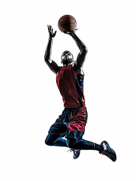 istock african man basketball player jumping throwing silhouette 488888855