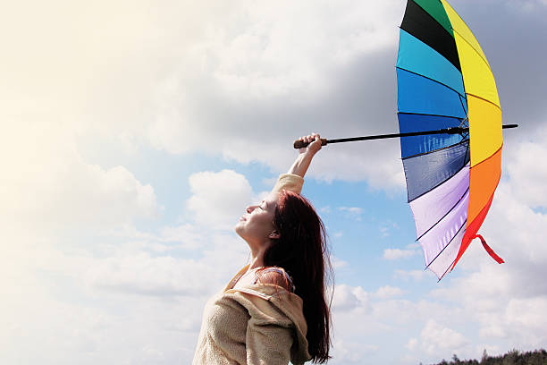 istock Woman with umbrella 488890429
