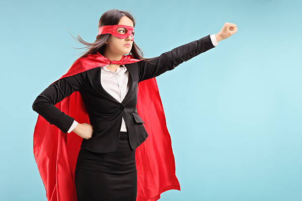 istock Female superhero with raised fist 488892109