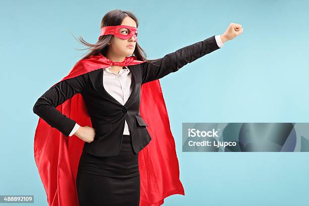 Female Superhero With Raised Fist Stock Photo - Download Image Now - Mask - Disguise, Superhero, 20-29 Years
