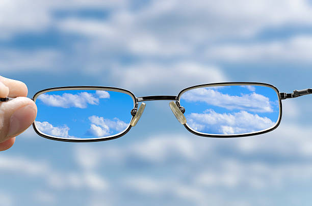 see the sky through glasses stock photo