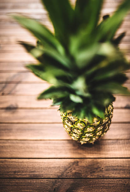istock Pineapple on vintage plank wood 488892181