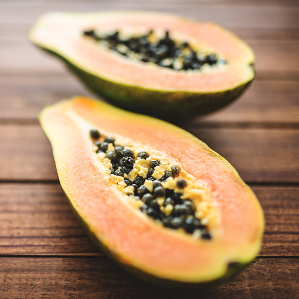 istock papaya on vintage plank wood 488892197