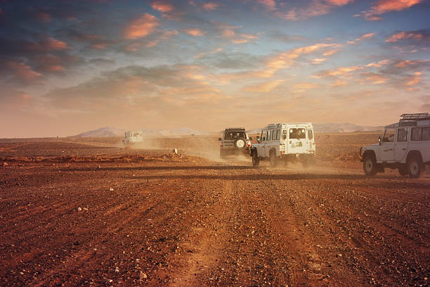 istock Cars in the desert at sunset 488892489