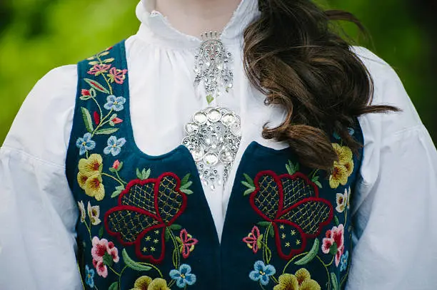 This is a photo of the Norwegian national costume, also called a bunad. It is being worn in celebration of this young woman´s confirmation, which is an important coming of age celebration in Norway. It is also always worn on the 17th of May and other important celebrations.