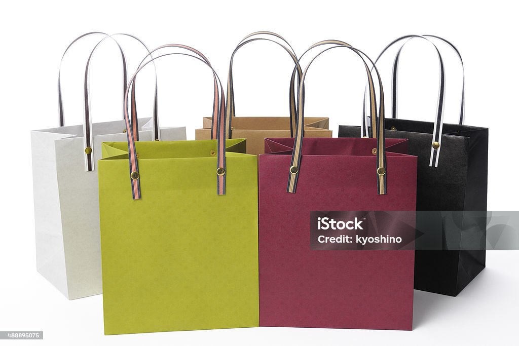 Row of colorful shopping bags on white background Row of colorful shopping bags isolated on white background with clipping path. Bag Stock Photo