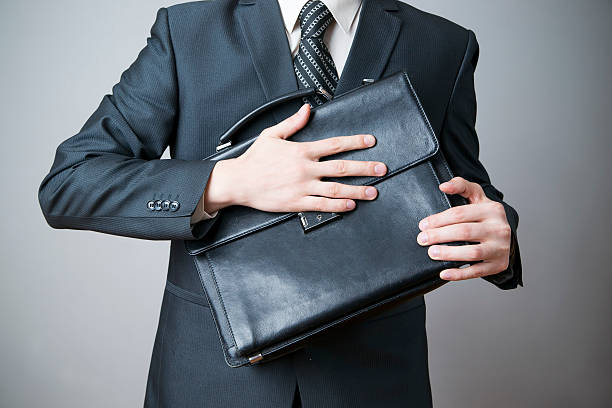 istock Businessman with briefcase in hand 488895351