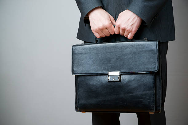 istock Businessman with briefcase in hand 488895387