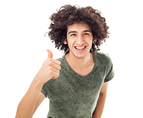 Young man showing OK sign with his thumb up