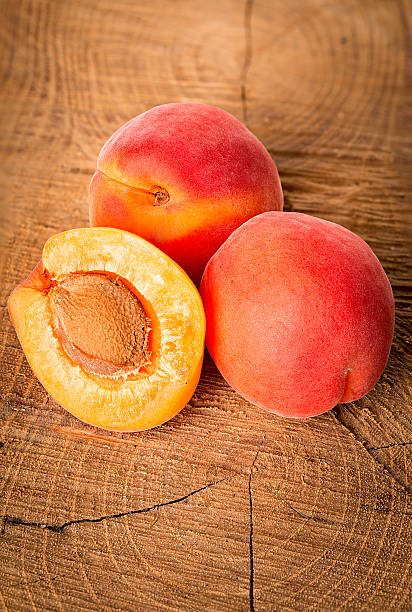 istock Apricots on the wooden background 488903658