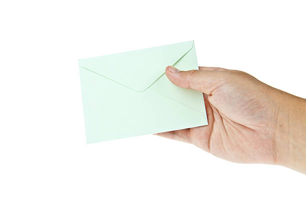 istock Green envelop with hand isolated on white background 488904558