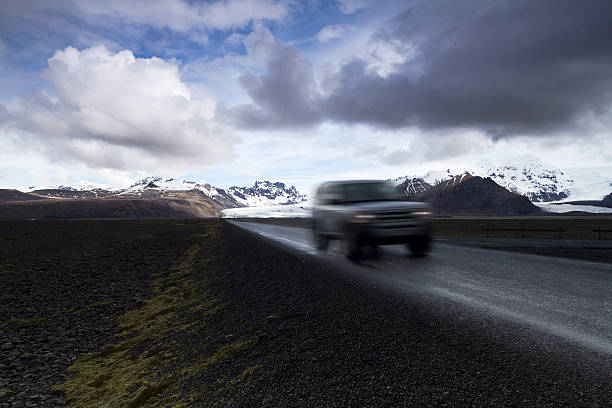 istock Offroad car on a straight road from the mountains 488905890