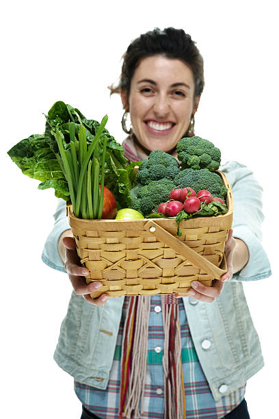 istock Cheerful woman holding vegetable basket 488909603