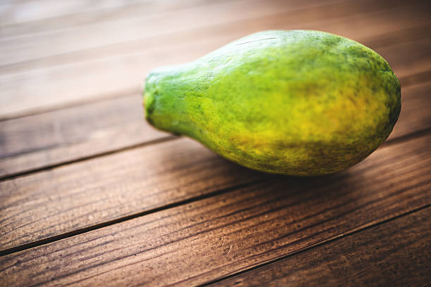 istock papaya on vintage plank wood 488909925